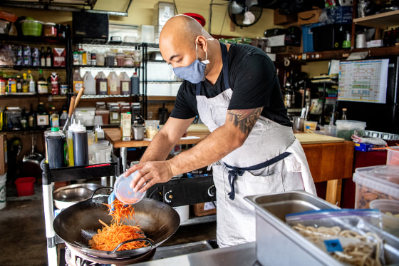 Kuya Lord prepares food at the Filipino pop-up restaurant he created in his garage in La Cañada Flintridge, Calif.