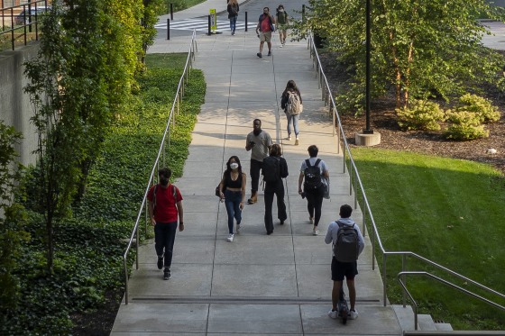 Students Walk on a university campus.