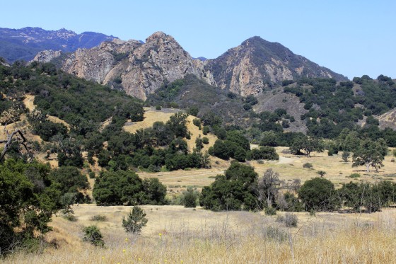 FILE - This July 1, 2018 file photo shows Malibu Creek State Park near Calabasas, Calif. The arraignment of a parolee charged with killing a man camping with his daughters at a Southern California state park in June and shooting at 10 people over the past two years has been postponed. Prosecutors said Monday, Jan. 7, 2019, that arraignment for Anthony Rauda was continued until Jan. 22 in Los Angeles County Superior Court.