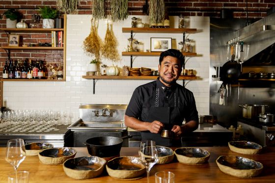 Chef Aaron Verzosa demonstrates plating Tailor Made, a course in which diners disclose their hunger level from five to one, at Filipino American restaurant Archipelago on May 24, 2023, in Seattle.