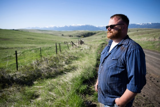 Garrett Mahon, a supporter of the Greater Idaho Movement, looks out over land in the direction of the Idaho border, near his 600-plus acre timber property in Wallowa, Oregon, on May 13, 2023.
