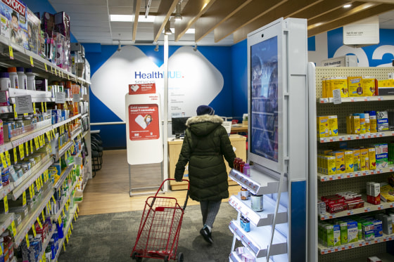 A person walks through a pharmacy in New York