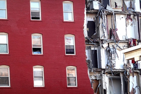 Search and rescue effort continue at a six-story apartment building on June 4, 2023, nearly a week after a section of the building collapsed in Davenport, Iowa.