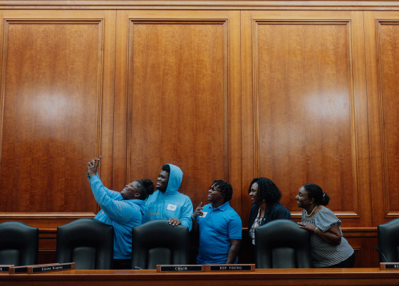 Leaders of the advocacy group Empowering Foster Youth Through Technology posed for a selfie with Rep. Stephanie A. Young and Saba Gebrai, right, on Tuesday after a hearing on bills to improve education for teens in foster care.