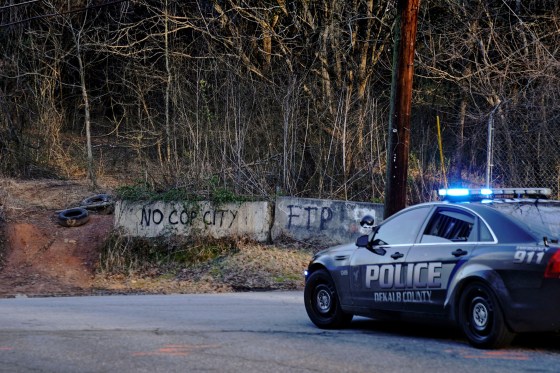 Law enforcement drive past the planned site of a police training facility that activists have nicknamed "Cop City," near Atlanta on Feb. 6, 2023.