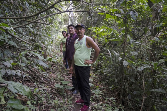 Residents of Puerto Franco, a Kichwa community, walk near the edge of the Cordillera Azul National Park in Peru's Amazon on Oct. 3, 2022.