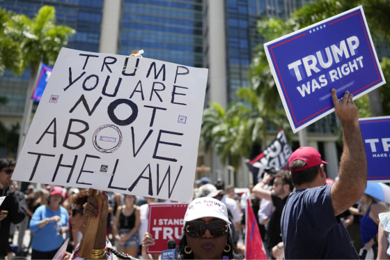 People rally outside the Wilkie D. Ferguson Jr. U.S. Courthouse, in Miami