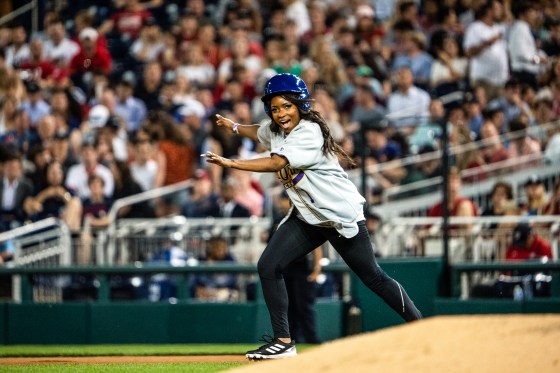Jasmine Crockett, D-Texas, attempts to steal second base during Congressional Baseball Game at National Park in Washington on June 14, 2023.