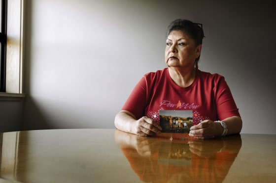 Ernestine Morning Owl holds a family photo that includes her sister Mavis Nelson who went missing and was discovered murdered in a Seattle park last year.