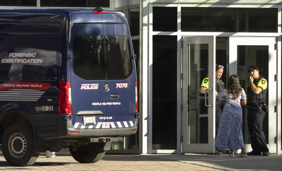 Members of the Waterloo Regional Police investigate a stabbing at the University of Waterloo, in Waterloo, Ontario