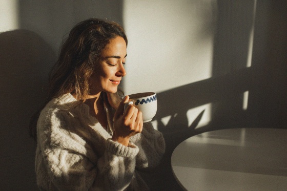 A woman drinking coffee