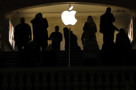 People shop in an Apple retail store in New York City