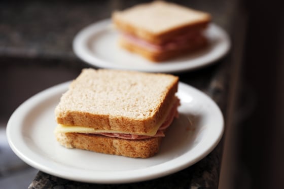A simple sandwich on white plate.