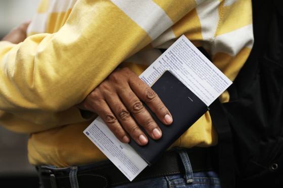 A man holds his passport and declaration as he goes through U.S. Customs and Border Protection at the San Francisco International airport