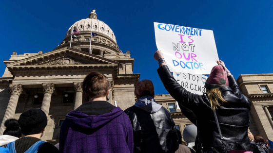 People gather at the state Capitol to oppose anti-transgender legislation