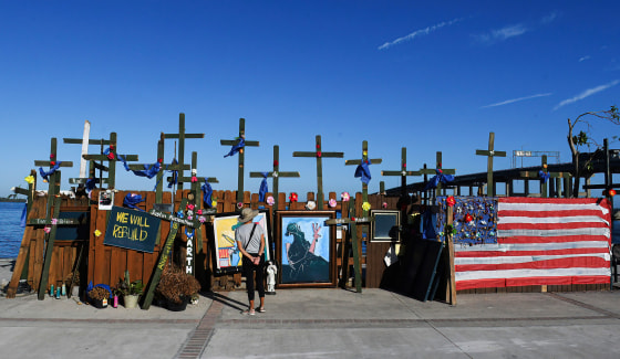 A memorial wall for victims of Hurricane Ian in Centennial Park in Fort Myers, Fla.