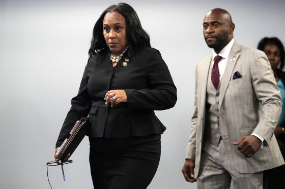 Fulton County District Attorney Fani Willis enteres a room in the Fulton County Government Center ahead of a news conference, Monday, Aug. 14, 2023, in Atlanta. Donald Trump and several allies have been indicted in Georgia over efforts to overturn his 2020 election loss in the state.