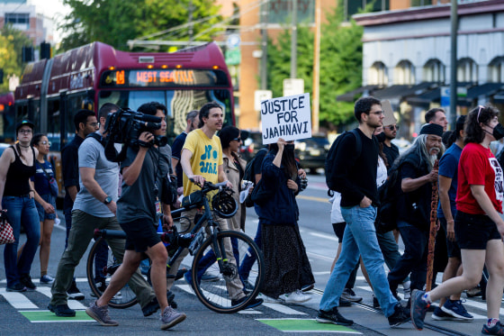Protesters march through downtown Seattle on Thursday  after body camera footage was released following the death in January of Jaahnavi Kandula, a 23-year-old woman hit and killed by officer Kevin Dave in a police cruiser.