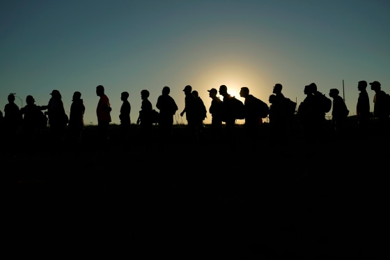 queue line silhouette sun