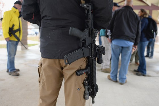 Open carry gun activists participate in a march in Ferguson, Missouri.