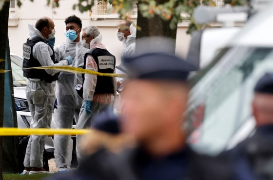 Image: French police and forensic investigators near Gambetta high school after a teacher was killed and two others wounded in a knife attack on Friday.
