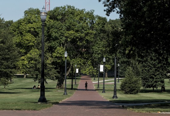 A lone person makes their way through the "Oval" at the Ohio State University in Columbus in 2020.