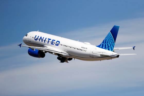 A United Airlines jetliner lifts off from a runway at Denver International Airport