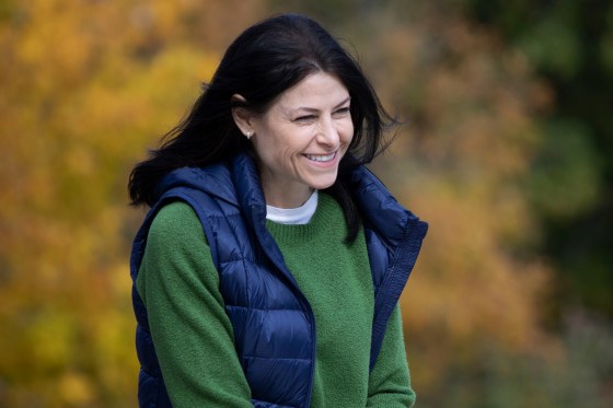 Michigan Attorney General Dana Nessel heads to the stage to speak at a campaign rally.