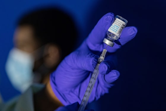 A family nurse practitioner prepares a syringe with the Mpox vaccine for inoculating a patient.