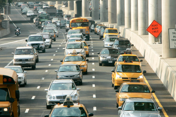 Cars make their way in heavy traffic along the Van Wyck Expressway in Queens, N.Y.