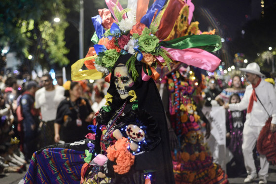A person dressed as a 'Catrina' in the Annual Mega Parade of Catrinas 2023 during Día de los Muertos celebrations in Mexico City, Mexico on Oct. 22, 2023.