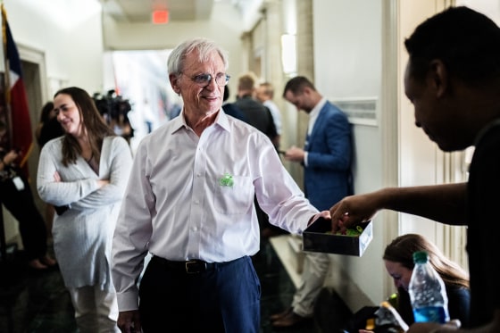 Rep. Earl Blumenauer, D-Ore., hands out bicycle pins outside a House Republican Conference speaker election meeting in Washington, DC. on Oct. 13, 2023.