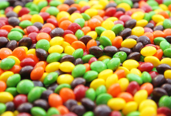A closeup of a bowl of Skittles.