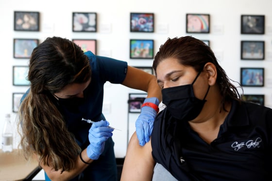 A registered nurse administers a dose Covid-19 vaccine in St. Petersburg, Fla, on Aug. 6, 2021.