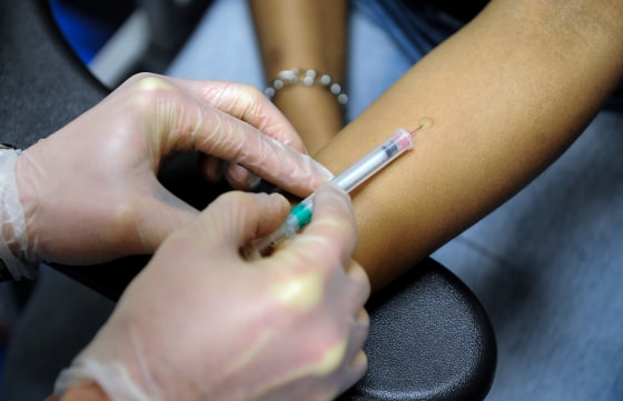 A Georgetown University medical student gives a tuberculosis skin test to a patient in Washington, DC. on Feb. 22, 2012.