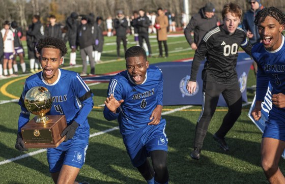 Lewiston's Abdishakur Nur, left, Obed Antonio, Payson Goyette and Caden Boone celebrate on Nov. 12, 2023 in Oakland, Maine.