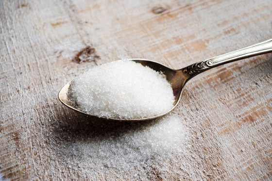 Artificial Sweeteners and Sugar Substitutes in metal spoon.
