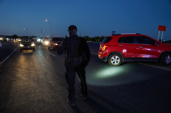Del Rio Police direct cars waiting at the US-Mexico border at the Del Rio International Bridge to leave after the bridge was closed temporarily after an influx of migrants, in Del Rio, Texas in 2021. 
