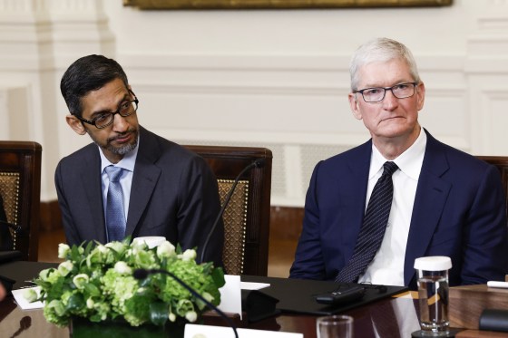 Google CEO Sundar Pichai, left, and Apple CEO Tim Cook listen as President Joe Biden speaks during a roundtable with American and Indian business leaders at the White House on June 23, 2023.