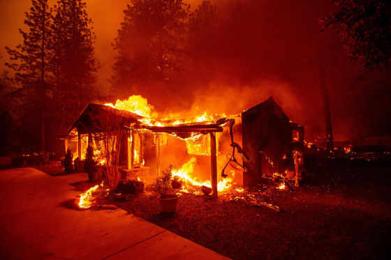 A home burns during the Camp fire in Paradise, Calif., in 2018.