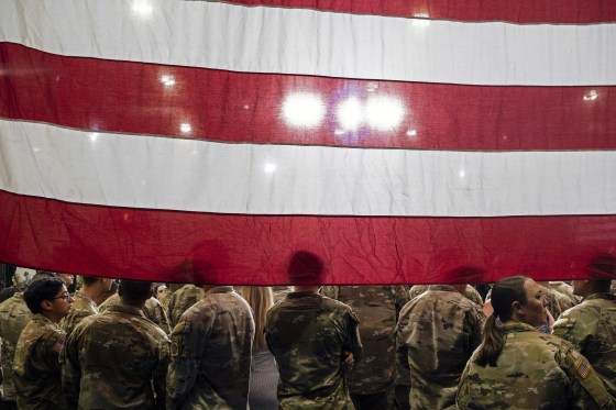 Image: Service members gather to hear President Joe Biden and First Lady Jill Biden speak