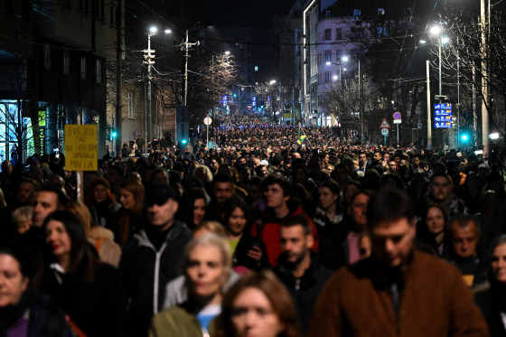Opposition supporters protest in the street/
