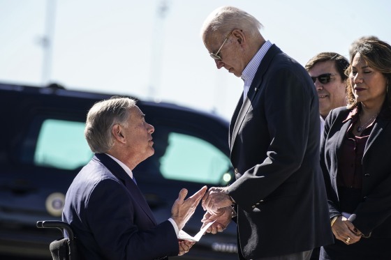 Texas Gov. Greg Abbott hands President Joe Biden a letter
