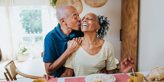 a man kissing a woman on the cheek for valentine's day