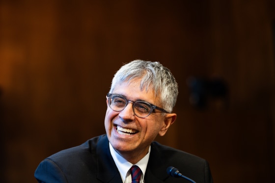 Adeel Mangi smiles during a nomination hearing.