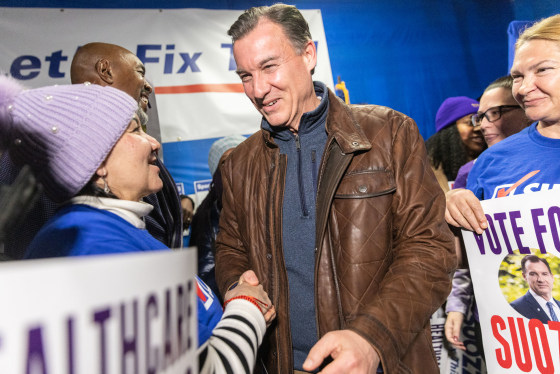 Tom Suozzi, Democratic House candidate for New York greets an attendee during the Westbury Canvass Launch in Westbury, New York, on Feb. 13, 2024.