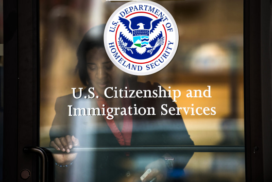 A woman leaves the U.S. Citizenship and Immigration Services offices in New York