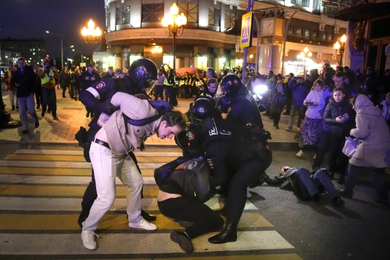Riot police detain two young men at a demonstration in Moscow, Russia, on Sept. 21, 2022. 