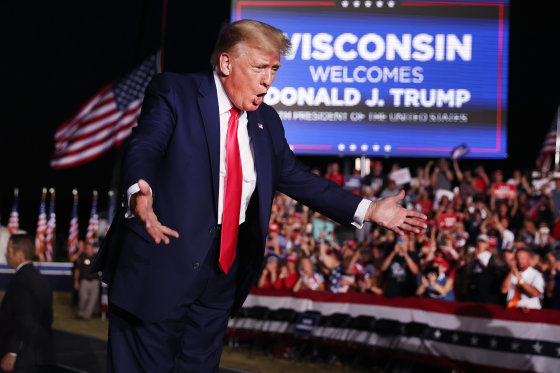 Donald Trump greets supporters during a rally