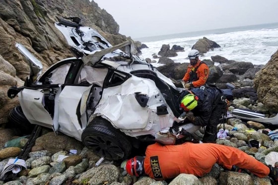 Emergency personnel at a car crash.